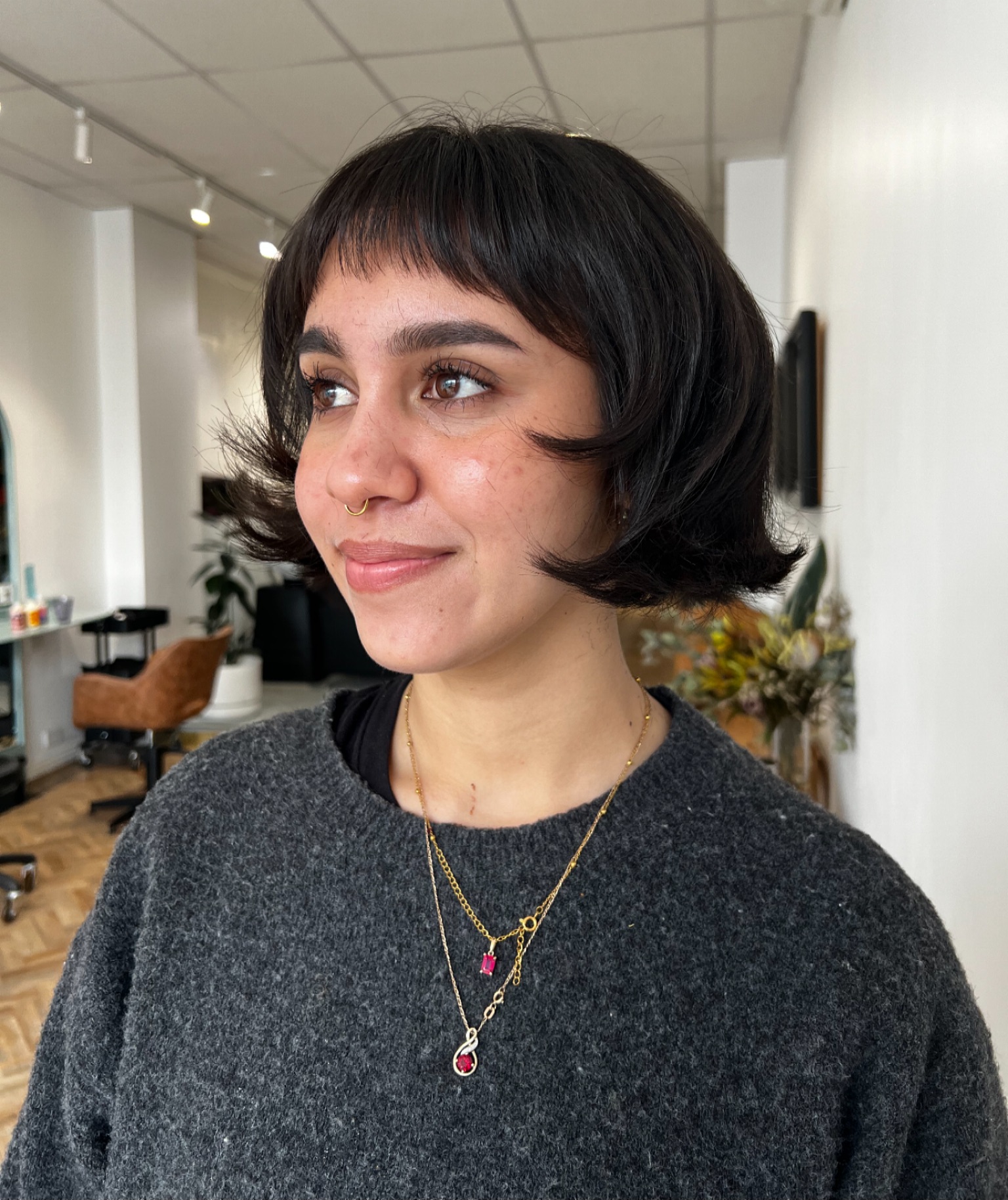 Effortless Jet-Black Curved Bob with Sheer Bangs