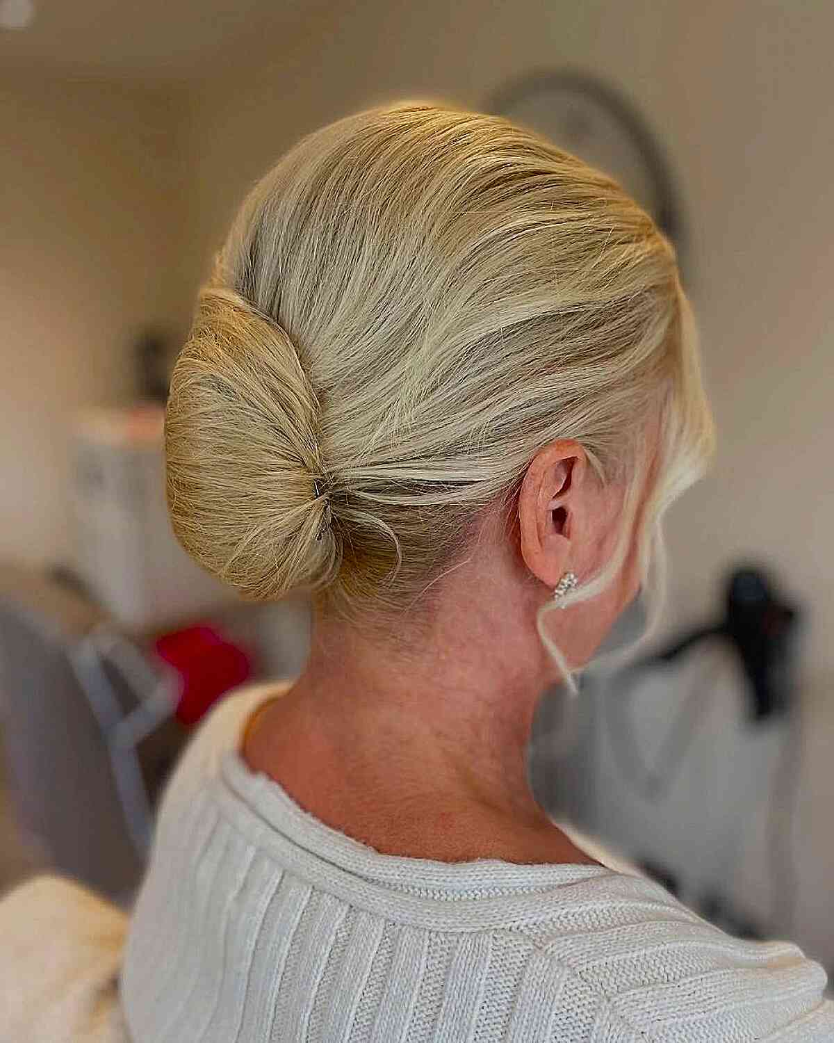 Elegant Low Chignon with Soft Face-Framing Pieces