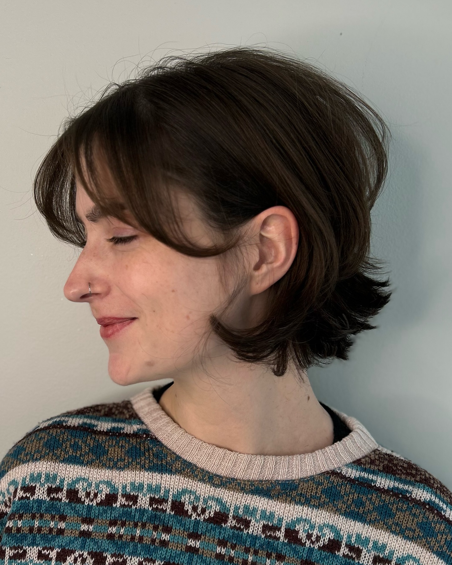 Lustrous Brunette Curved Bob with Swooped Bangs