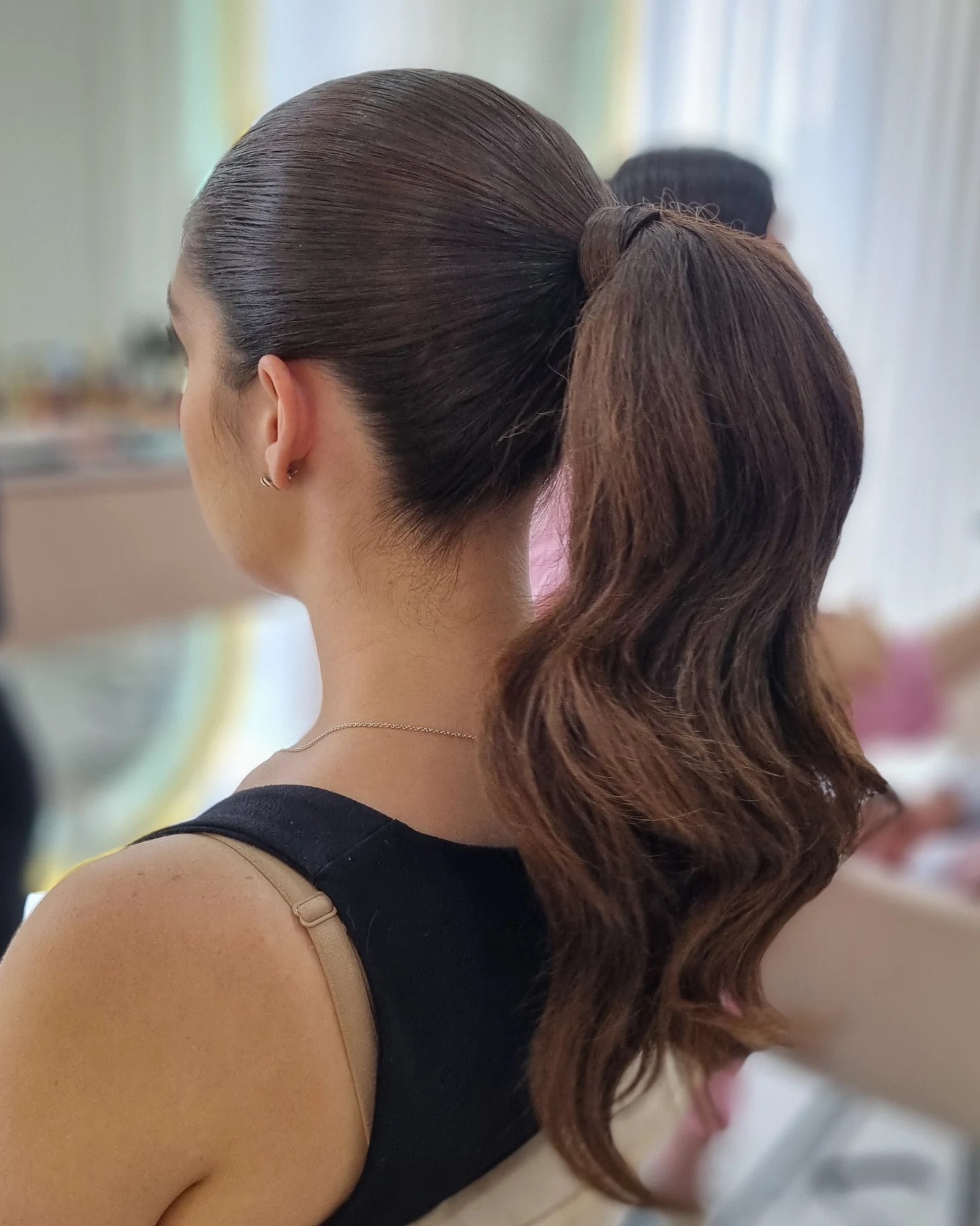 Sleek High Ponytail with Cascading Waves