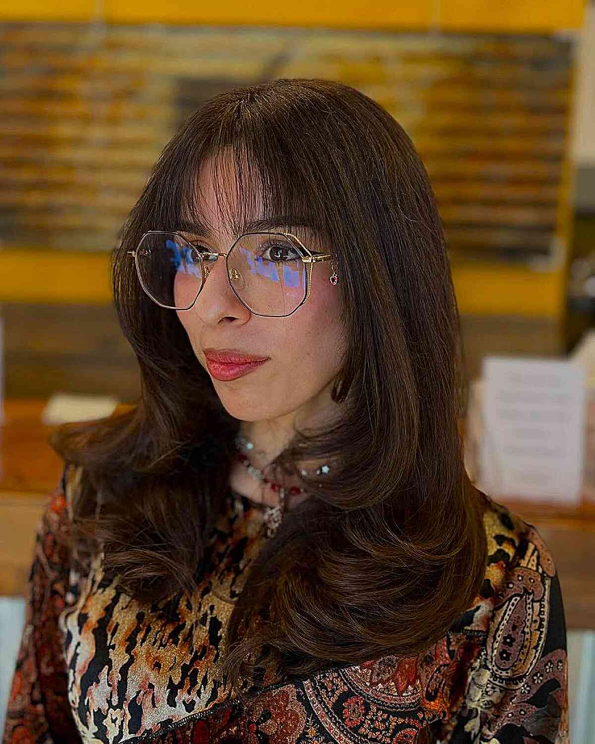 Sleek Layered Cut with Face-Framing Bangs