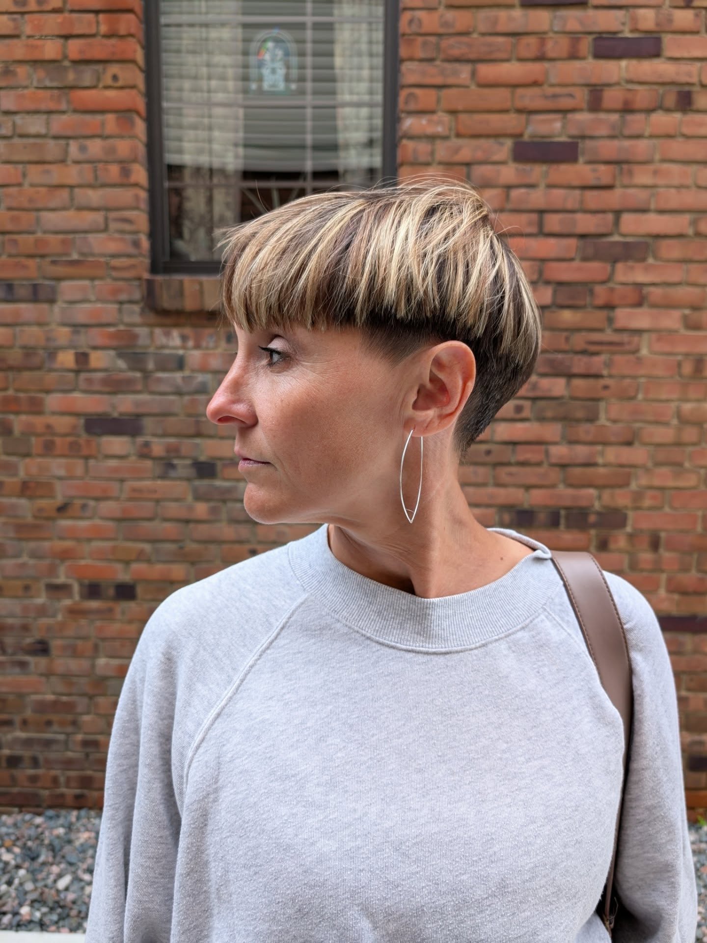 Unique Asymmetrical Bowl Cut with Subtle Highlights