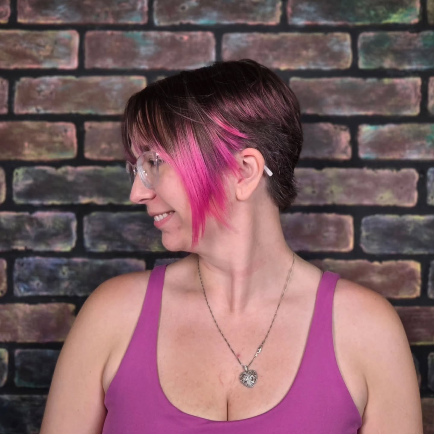 Bold Asymmetrical Pixie with Pink Highlights