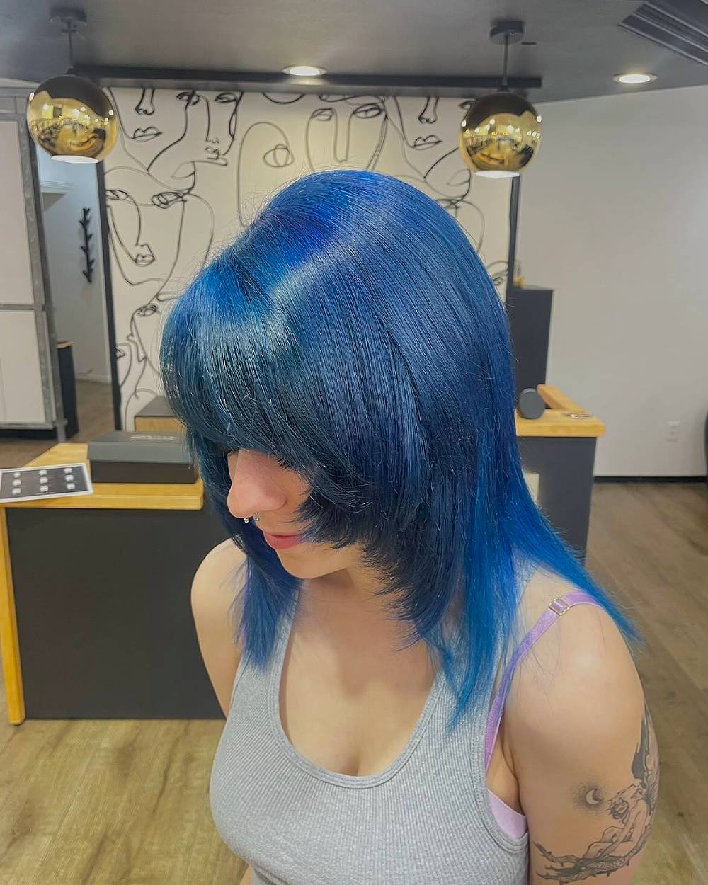 Bold Blue Hair with Dynamic Face-Framing Layers