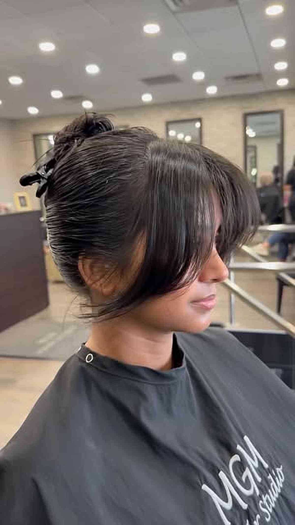 Bun with Curtain Bangs for a Fresh Look