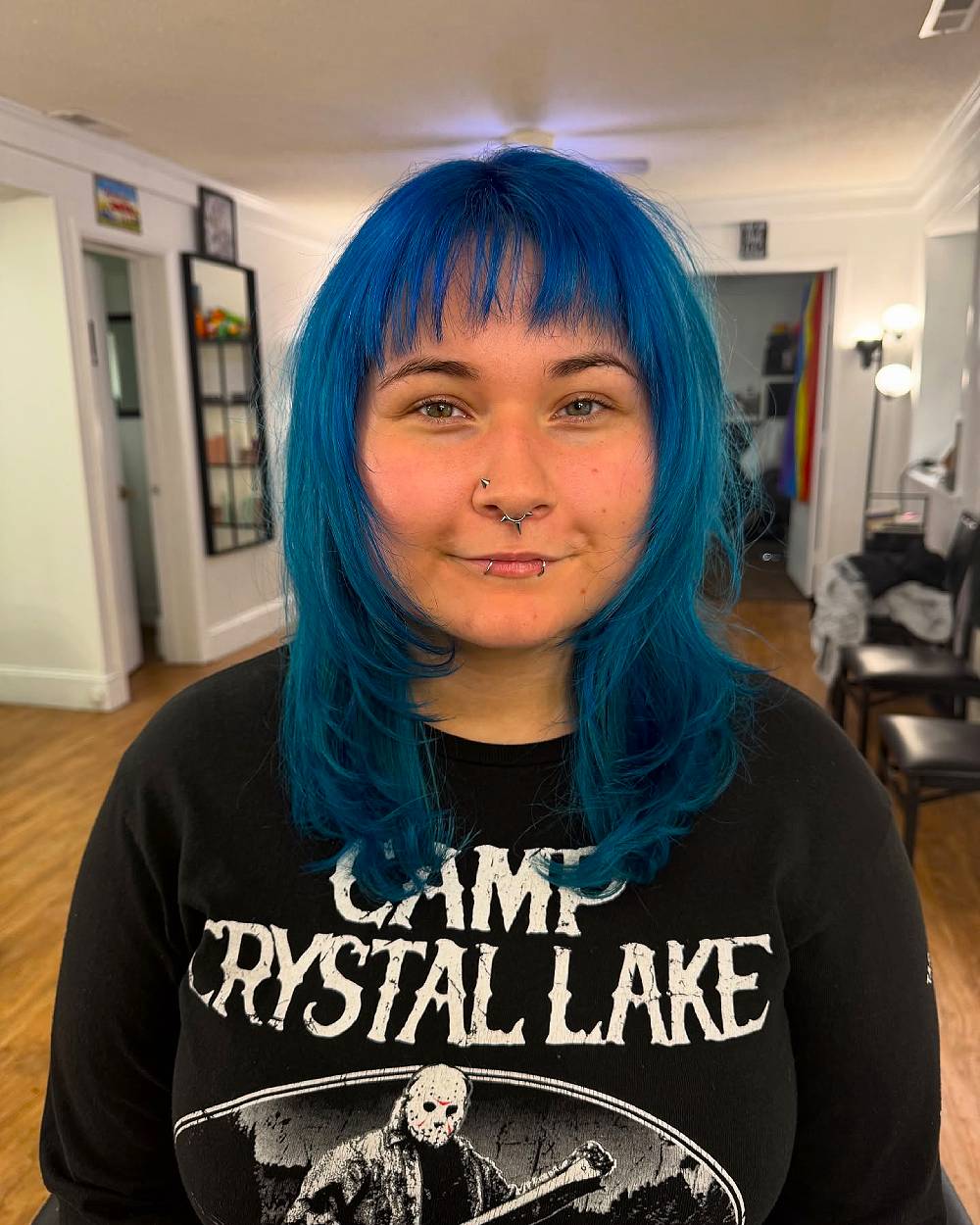 Chic Layered Blue Hair with Bold Bangs