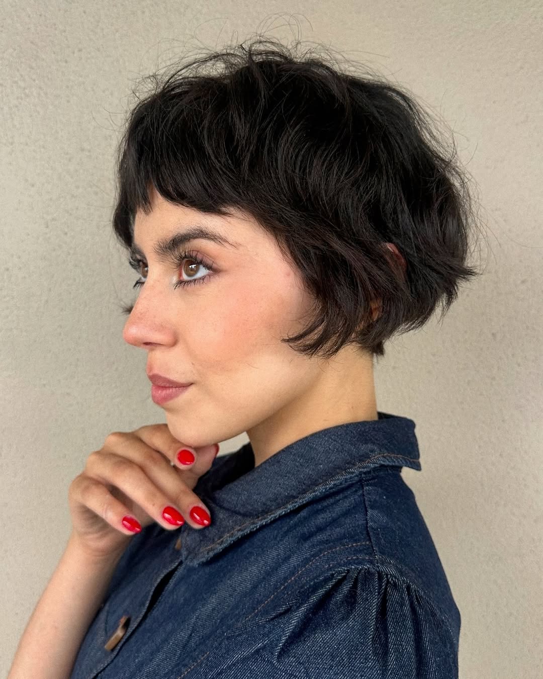 Edgy Textured Black Bob with Subtle Highlights