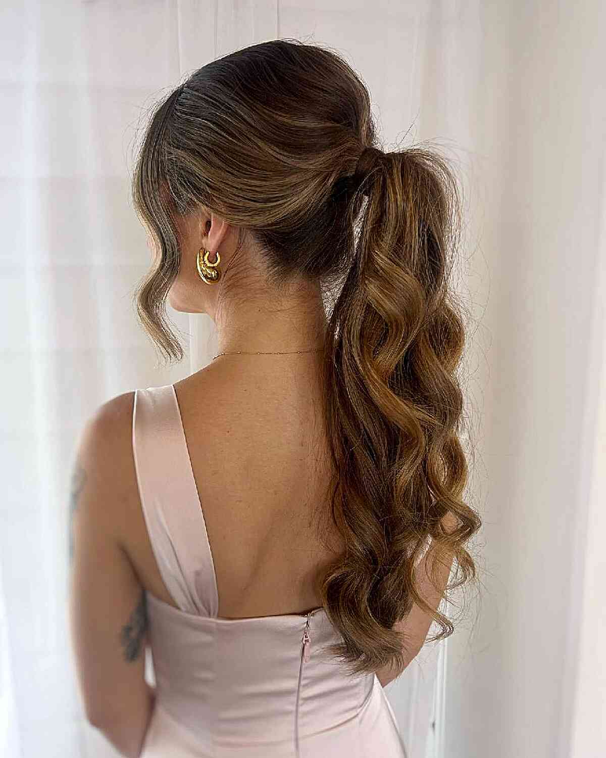 Elegant Curly High Ponytail with Soft Waves