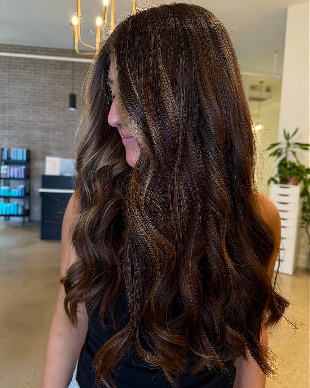Long Layered Dark Chocolate Hair with Warm Highlights