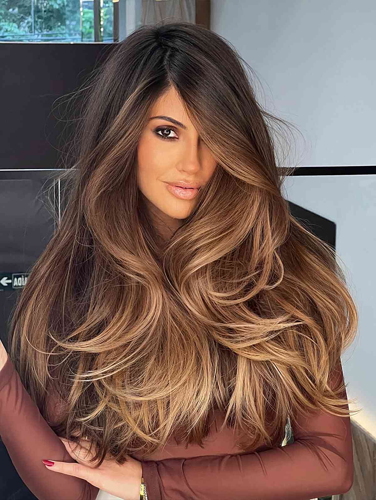 Luxurious Caramel Balayage on Long Layered Brunette Hair