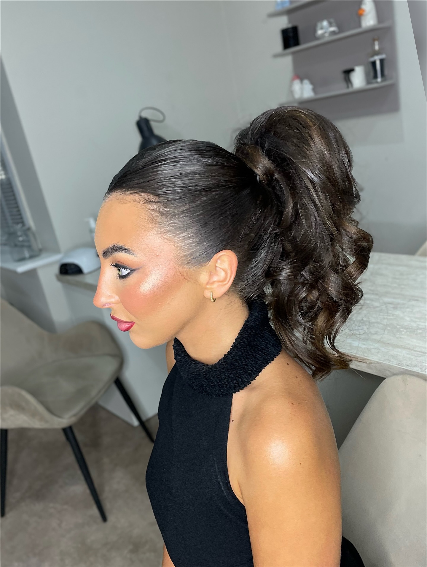 Sleek High Ponytail with Cascading Curls