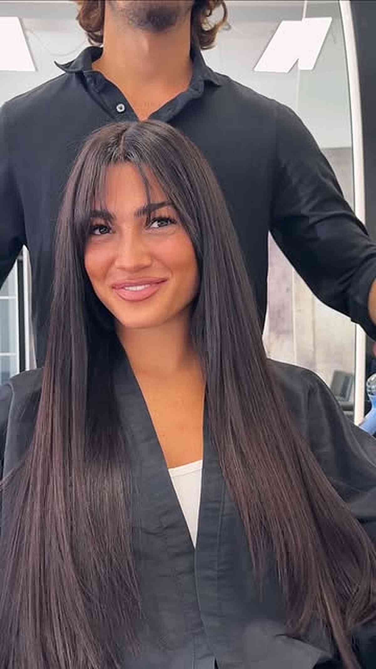Sleek Long Brown Hair with Layered Bangs