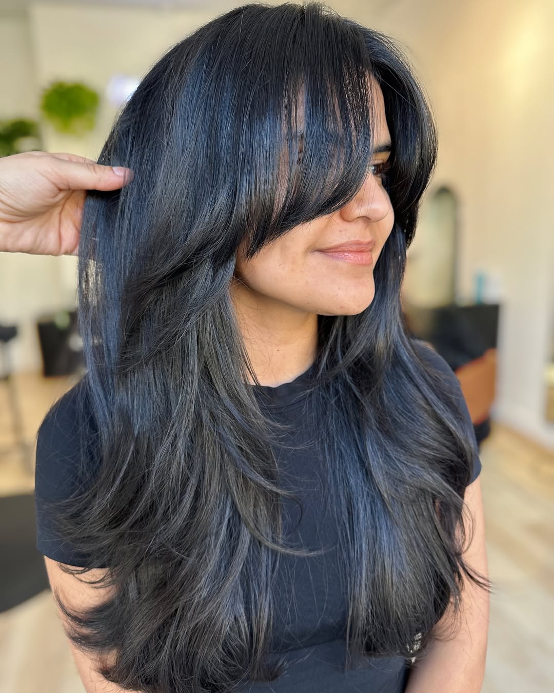 Sleek Midnight Blue Layers with Feathered Curtain Bangs