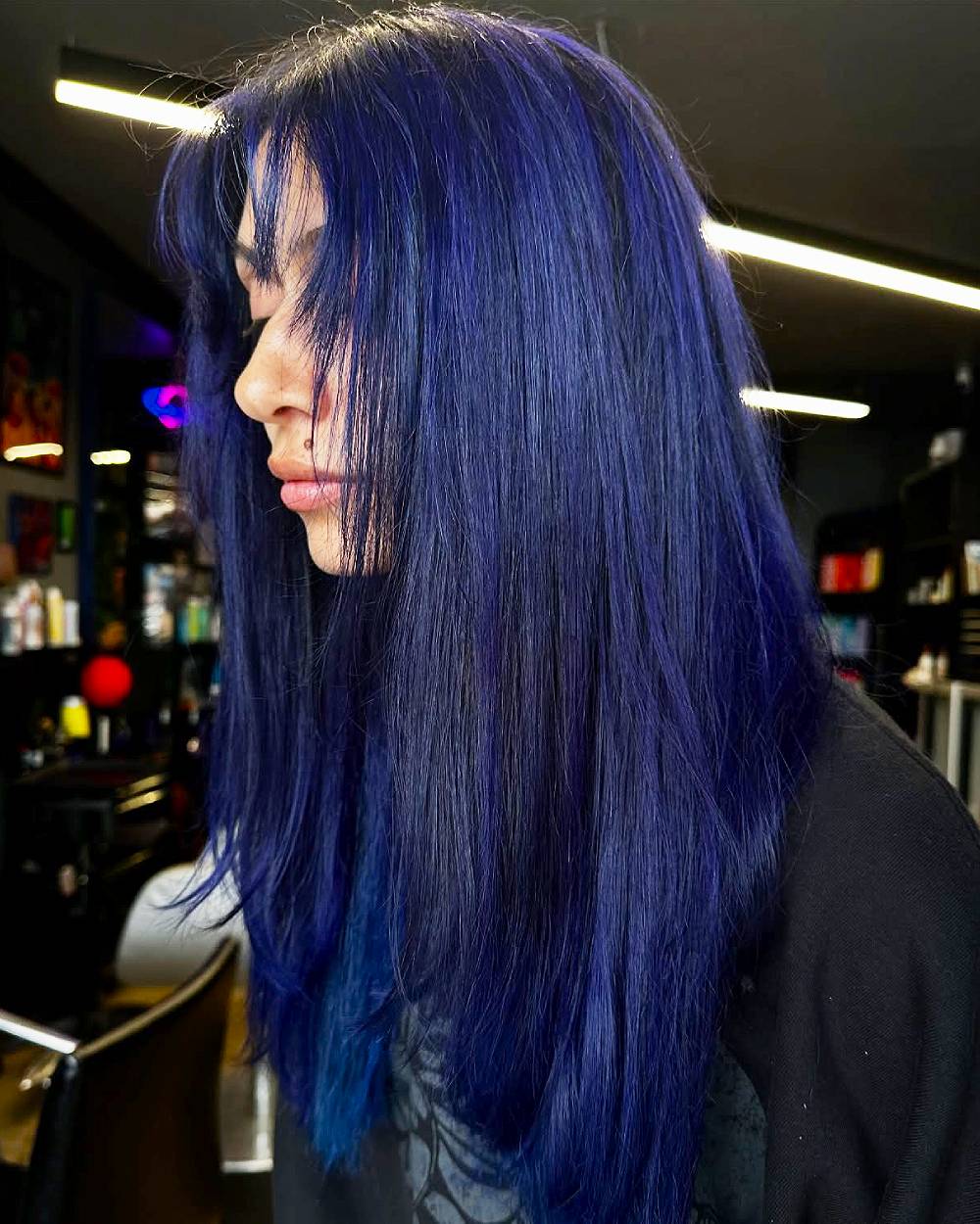 Vibrant Long Blue Hair with Soft Face-Framing Bangs