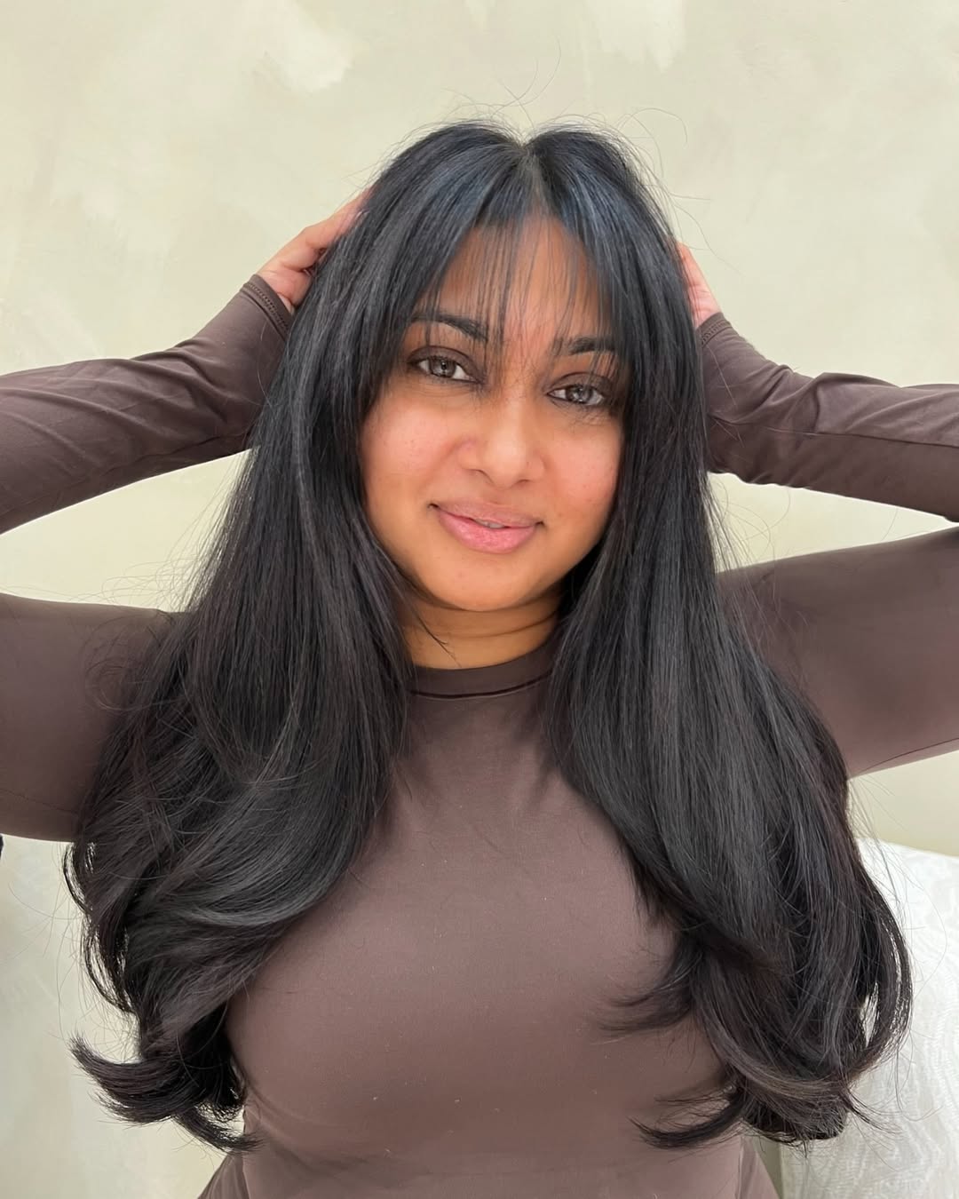 Elegant Long Layers with Feathered Wispy Bangs