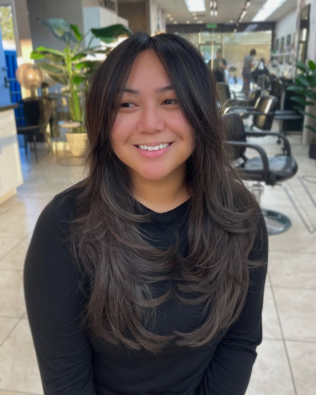 Flowing Brunette Waves with Feathered Ends