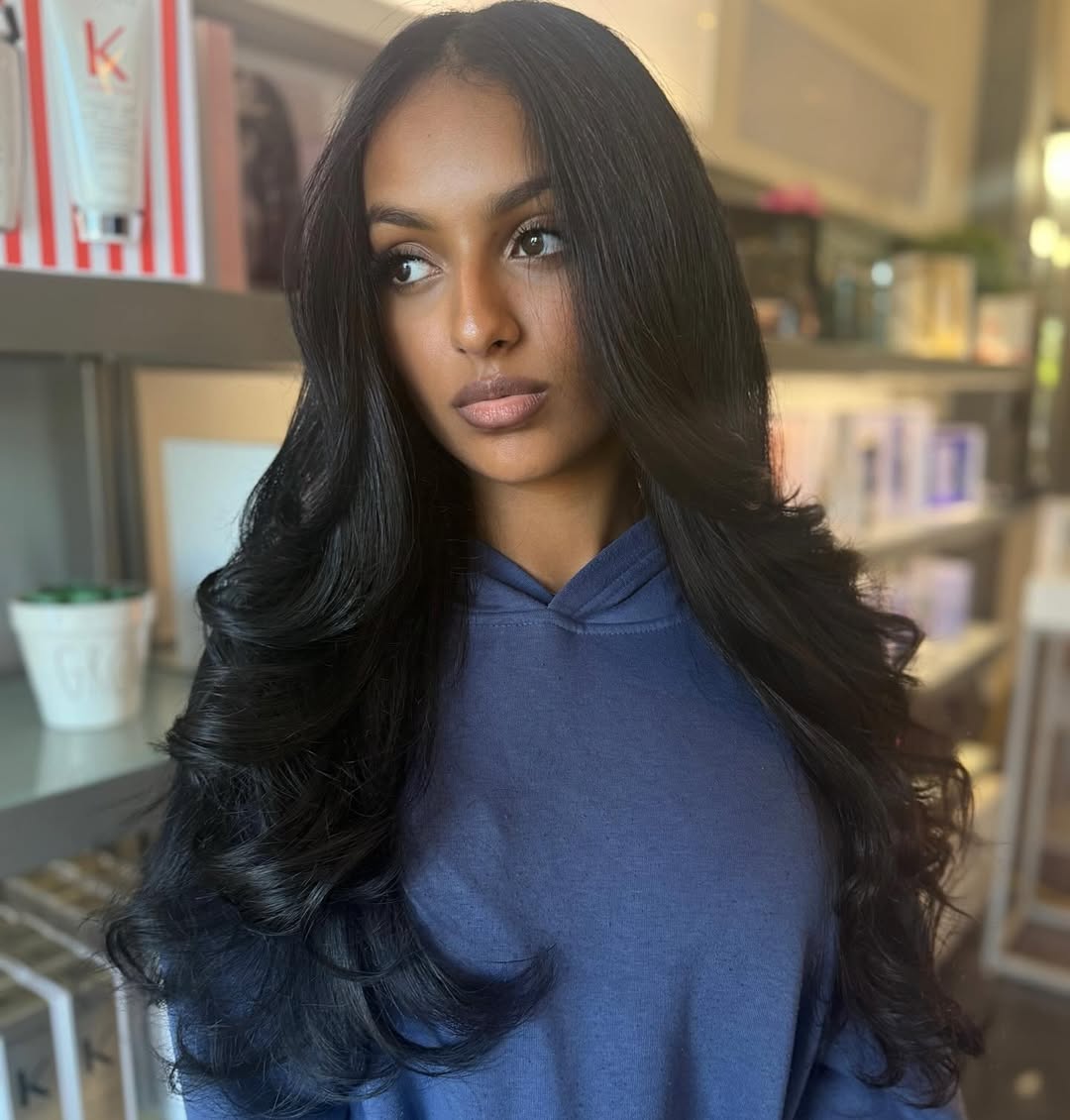 Luxurious Soft-Black Cascades with Sleek Voluminous Curls