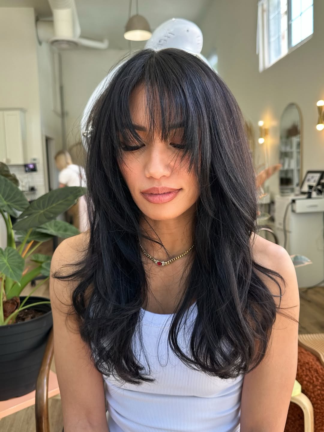 Midnight-Blue-Waves-with-Tousled-Layers-and-Feathered-Bangs