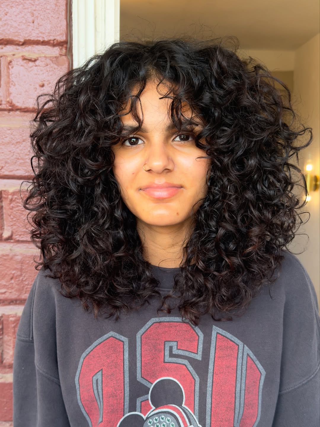 Playful Shoulder-Length Curly Layers