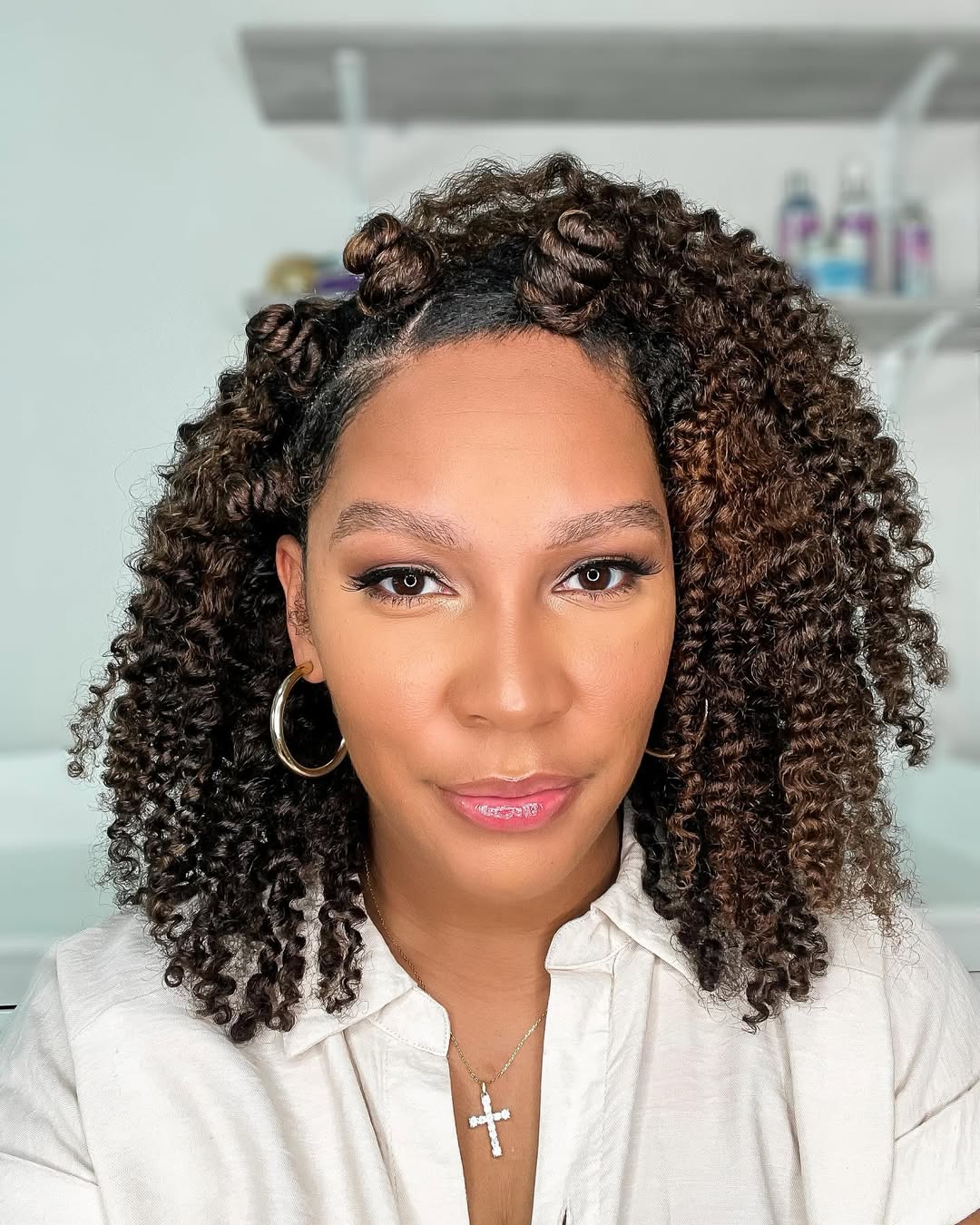 Twisted Curly Topknots with Free-Flowing Curls