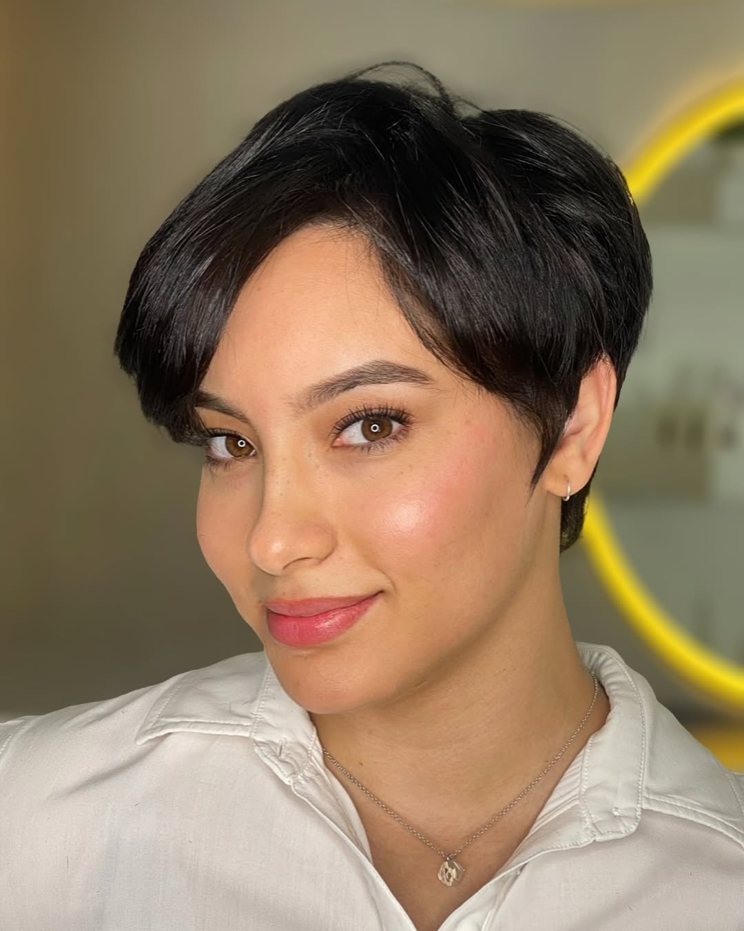 Sleek Brunette Pixie with Angled Bangs