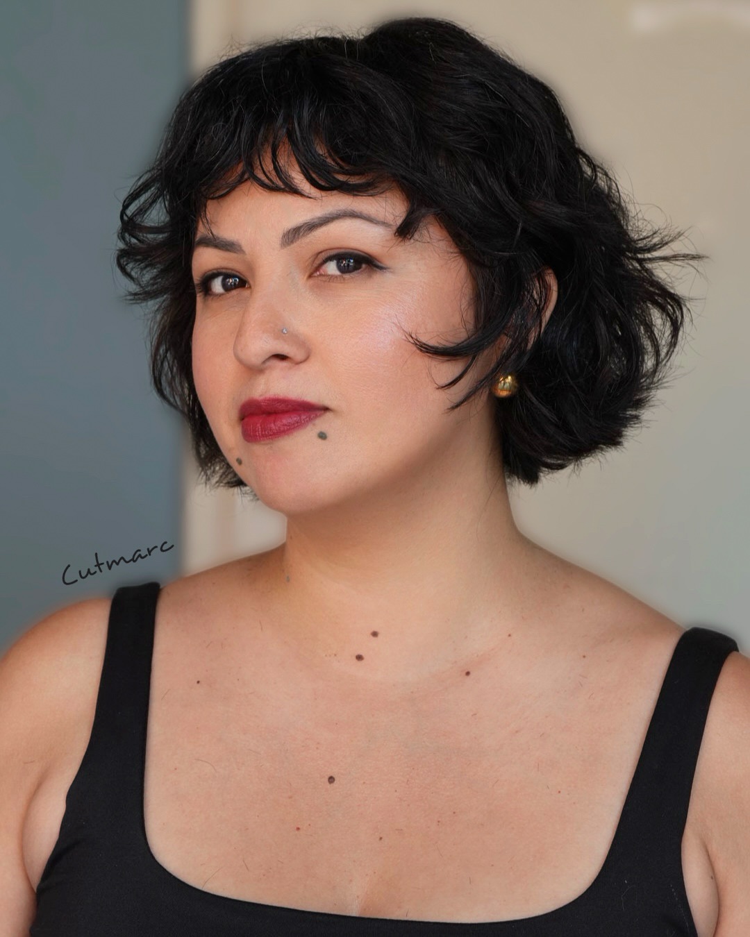 Curly Jet Black Rounded Bob with Side-Swept Bangs