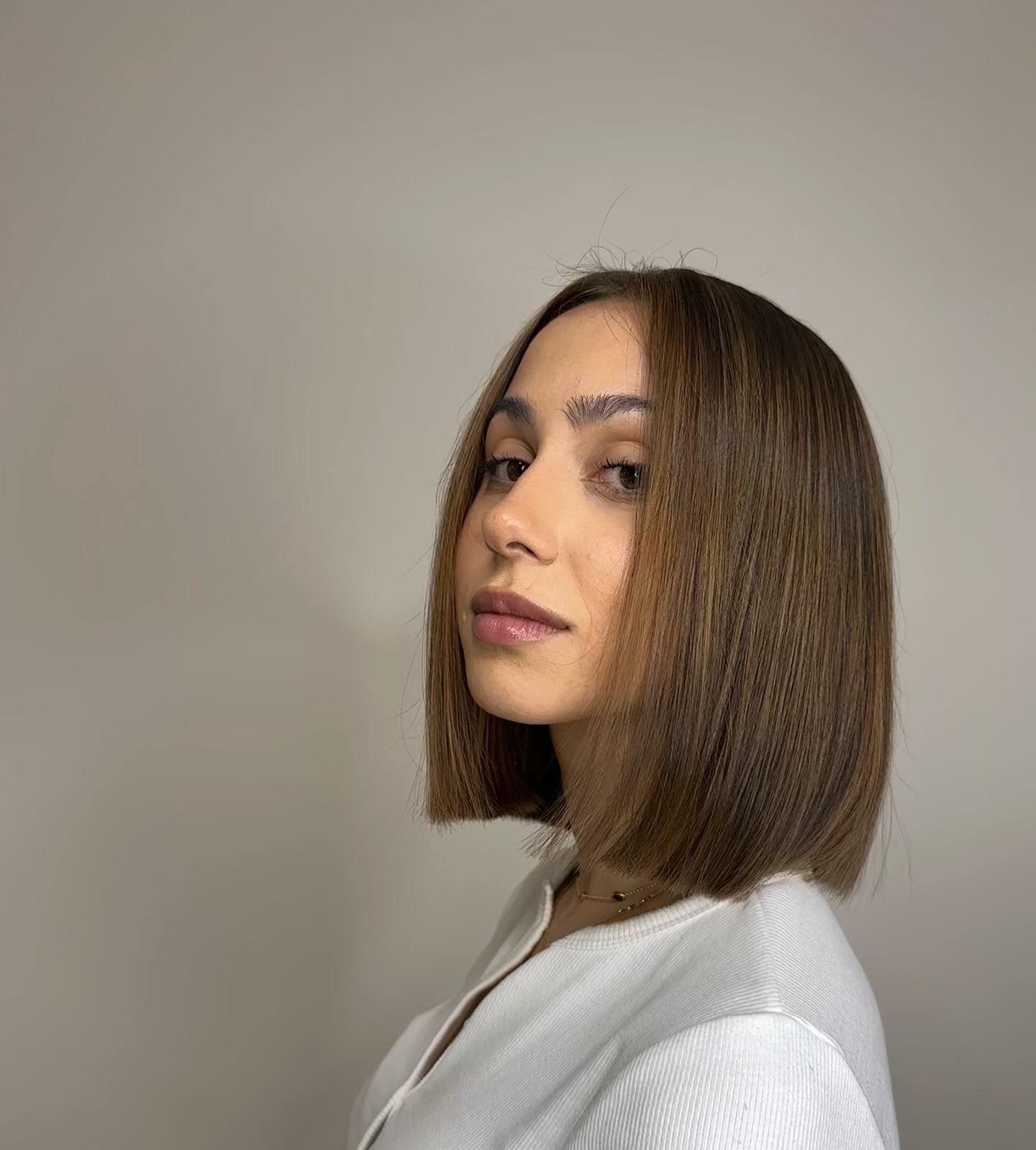 Sleek Chestnut Bob with a Hint of Caramel Balayage