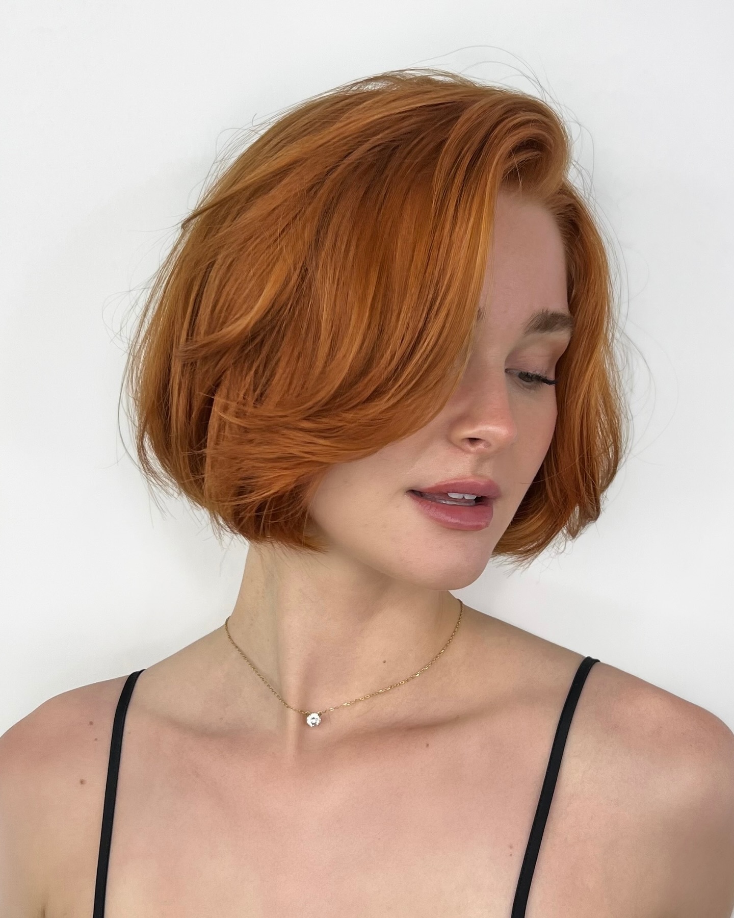 Vibrant Copper Side-Swept Bob