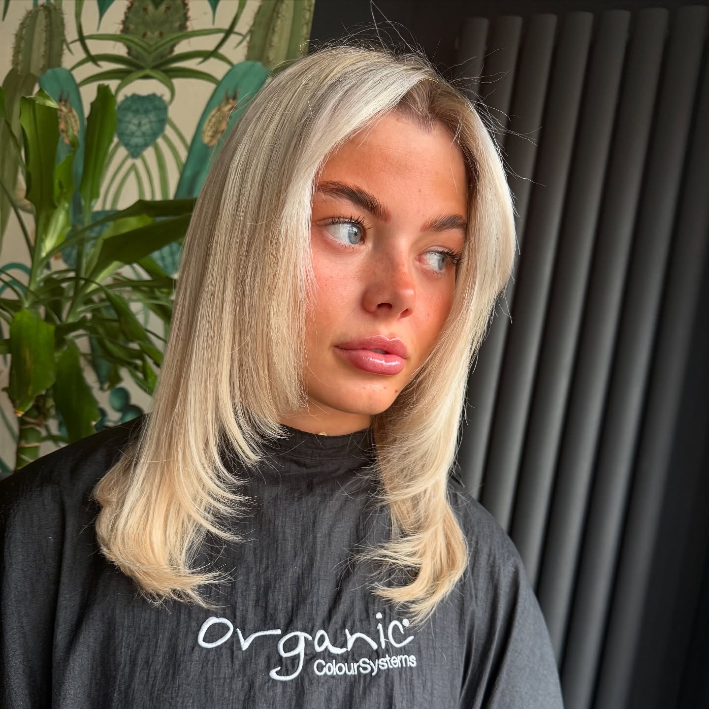 Chic Silver Blonde Feathered Bob with Textured Ends