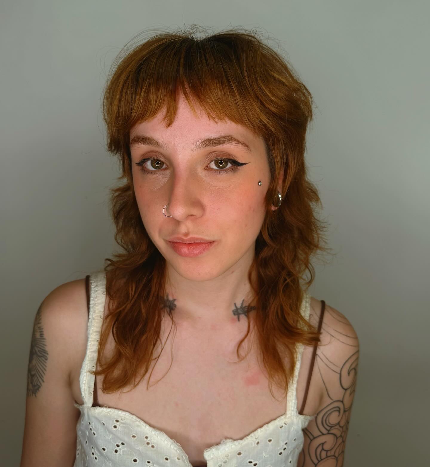 Copper-Toned Wavy Bob with Curtain Bangs