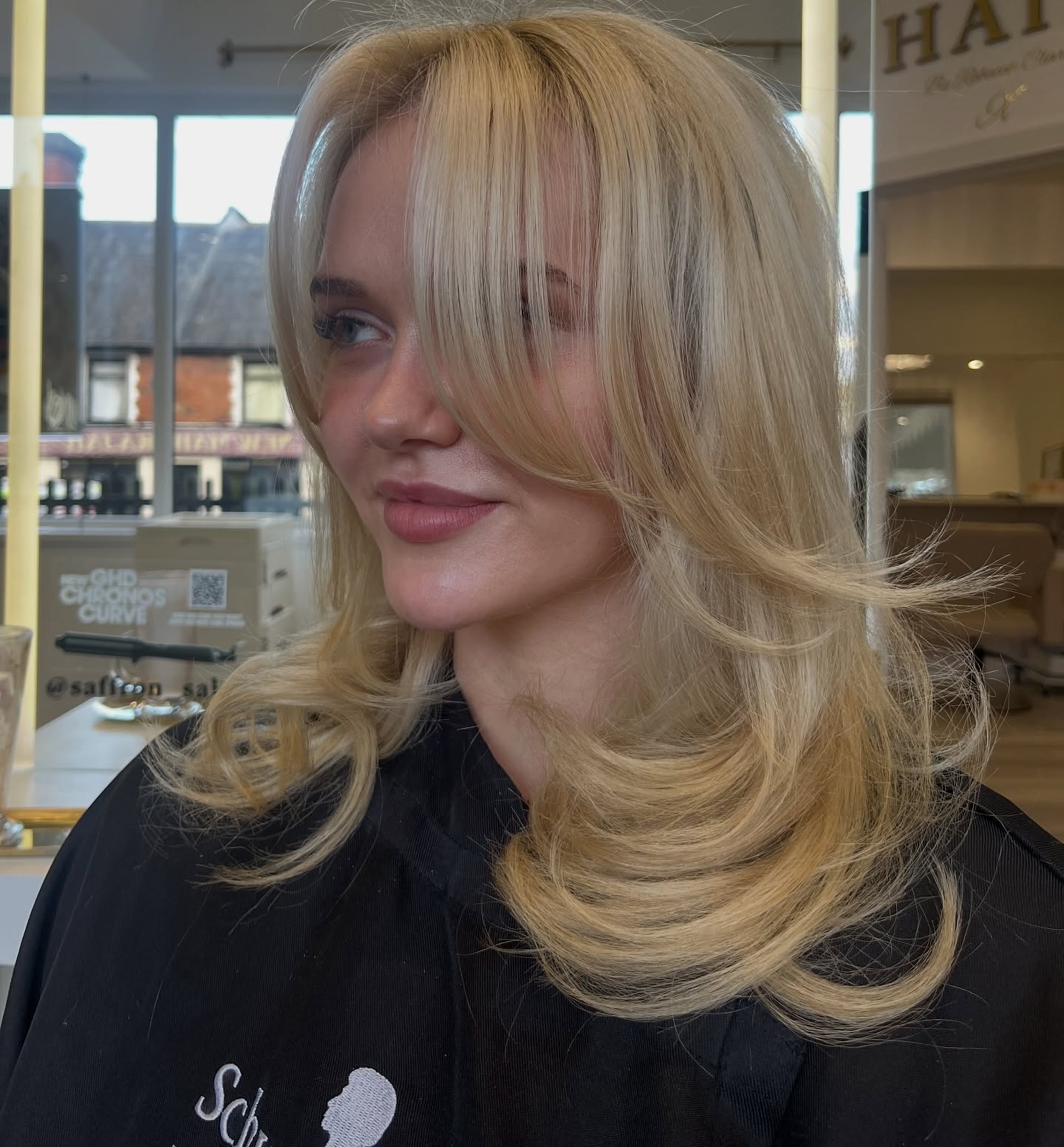 Flowing Platinum Blonde Layers with Soft Undercurls