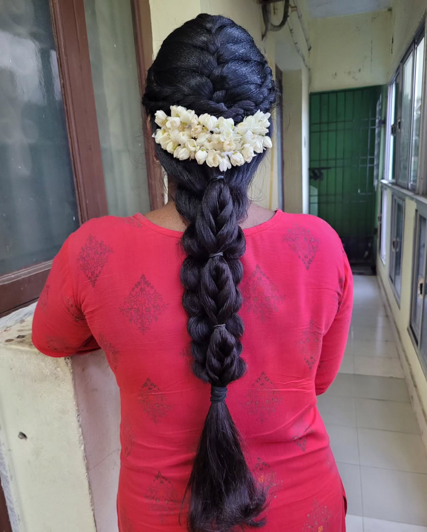 Intricate Traditional Braid with Floral Accent