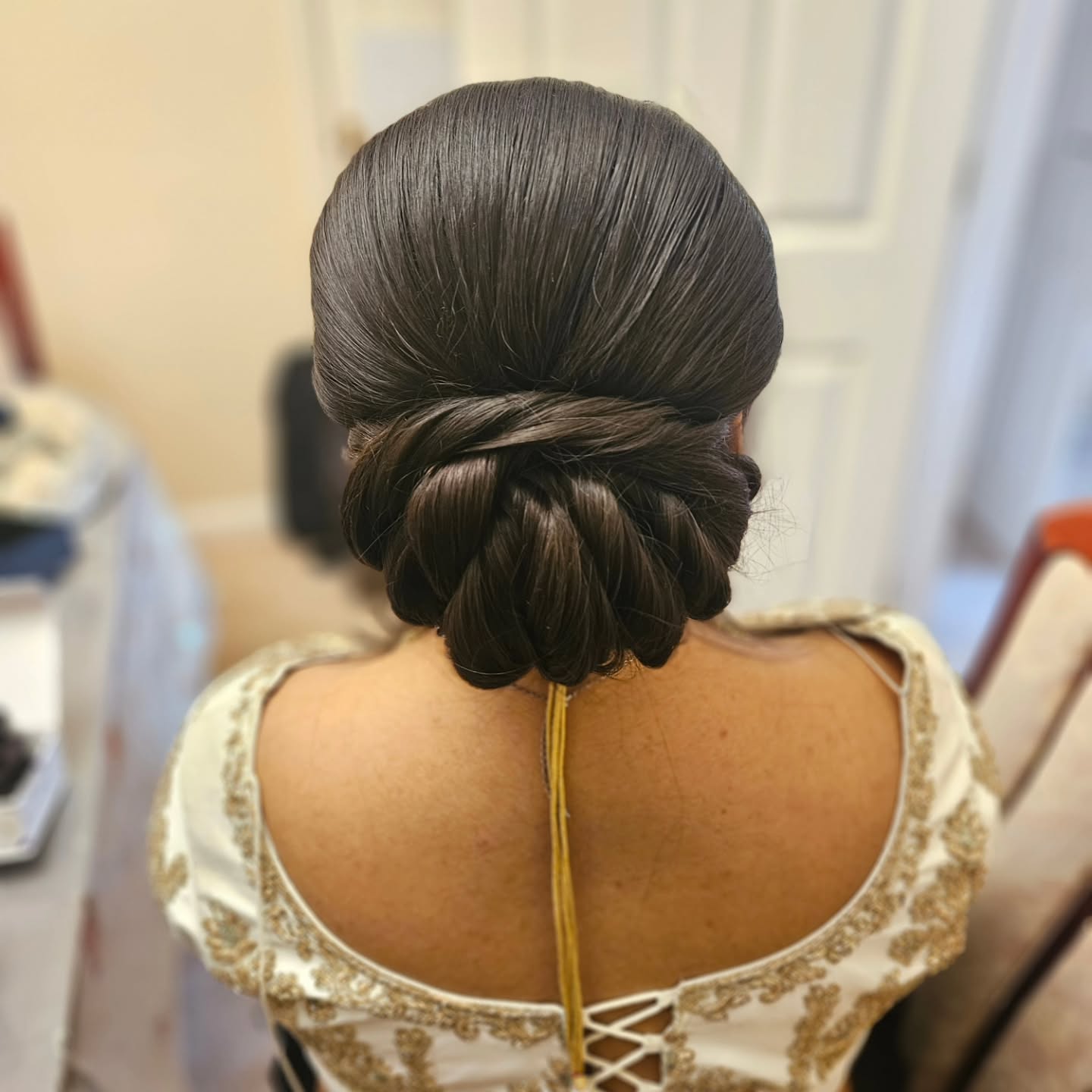 Sleek Twisted Low Chignon for Saree Elegance