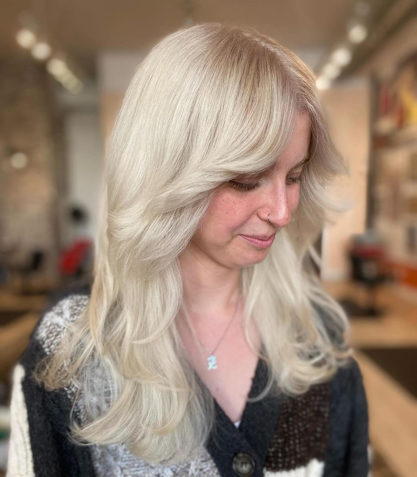 Soft Ice Blonde Waves with Delicate Feathering