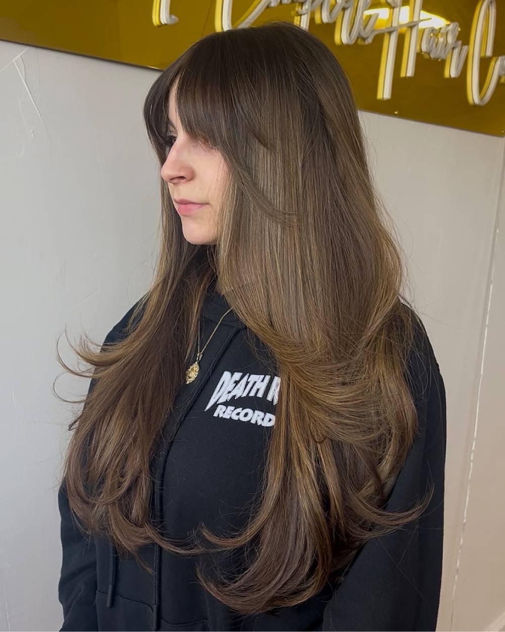 Stylish Long Layers with Subtle Face-Framing Bangs