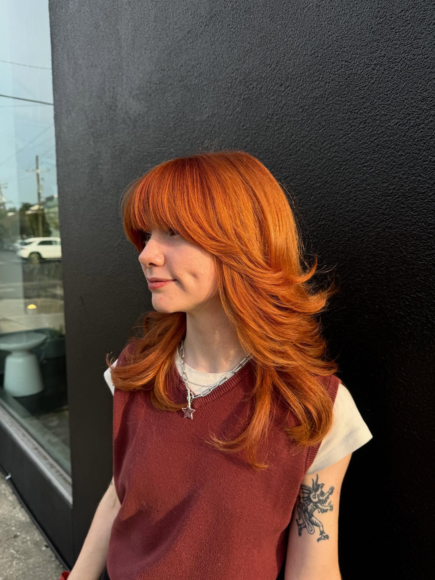 Vibrant Copper Feathered Layers with Face-Framing Fringe