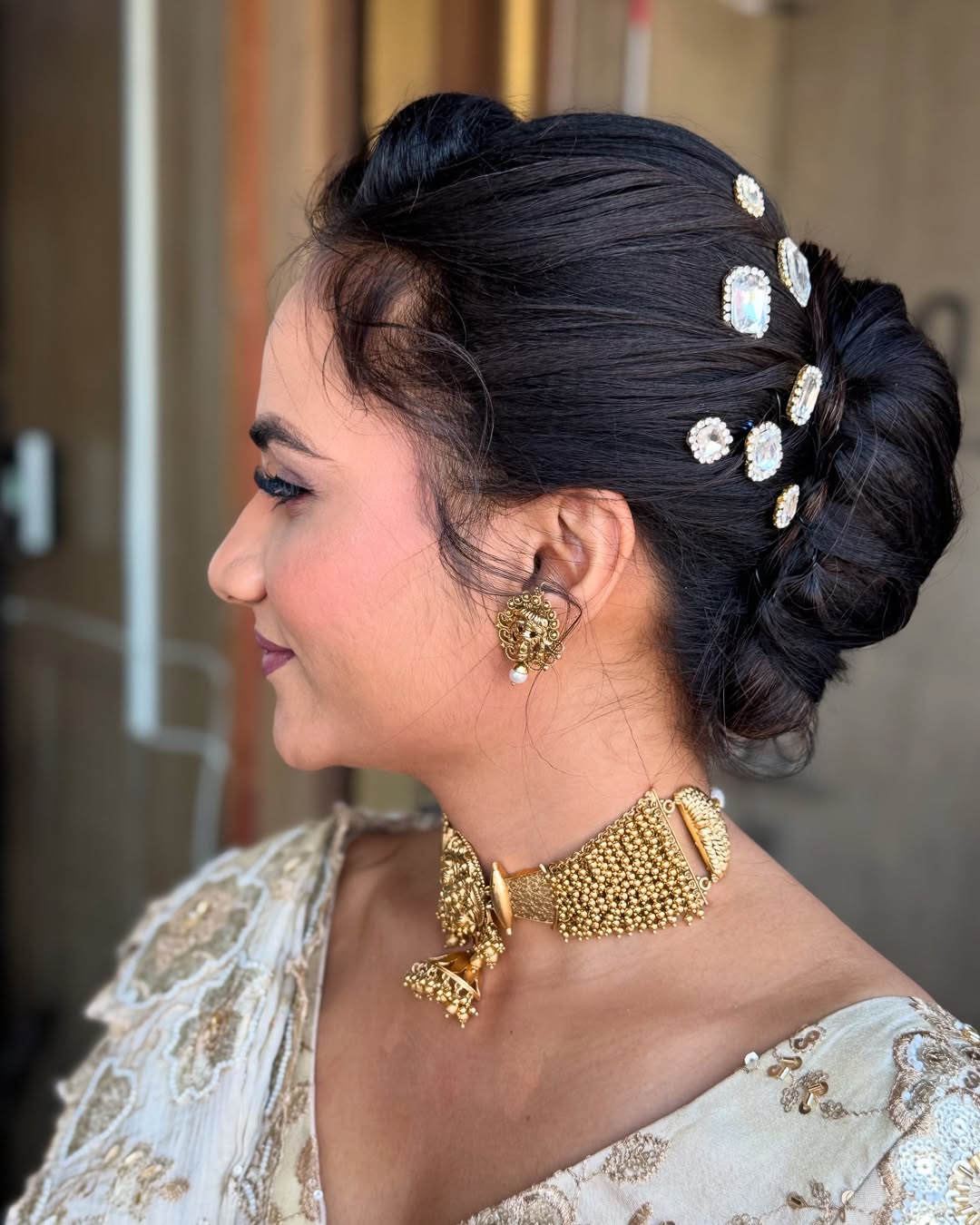 Elegant Embellished Low Bun with Side Part