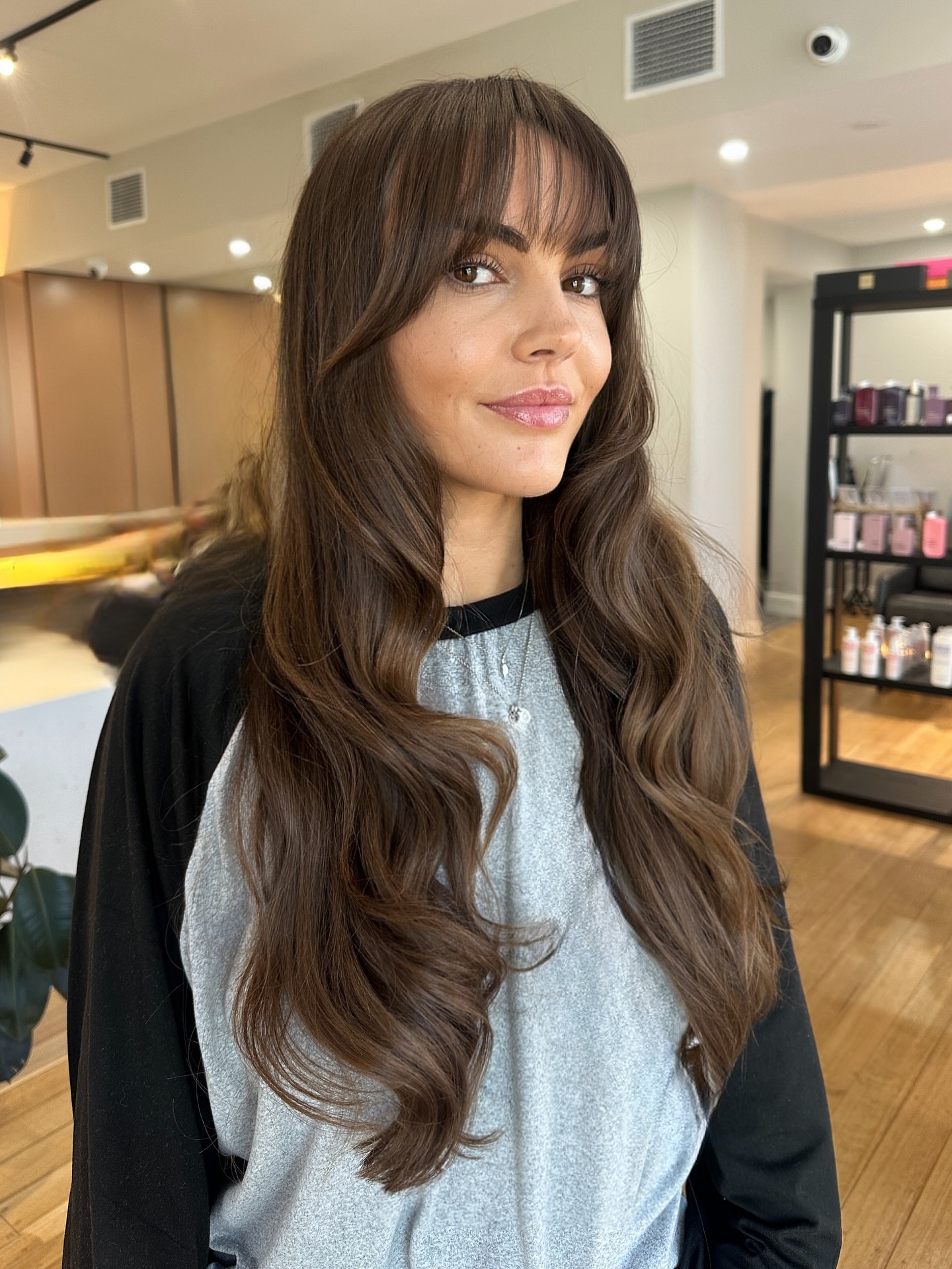 Flowing Chestnut Balayage with Seamless Curtain Bangs