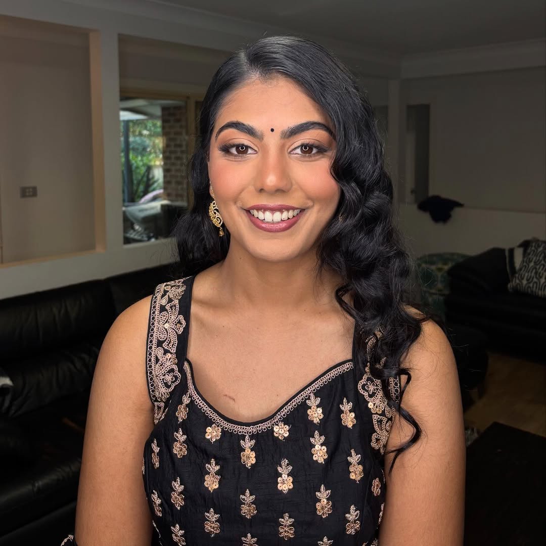 Glossy Cascading Side-Swept Curls