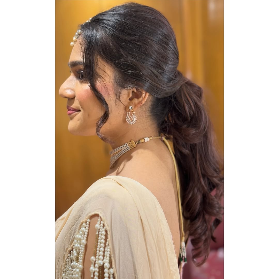 Regal Low Ponytail with Soft Curls and Pearl Accents