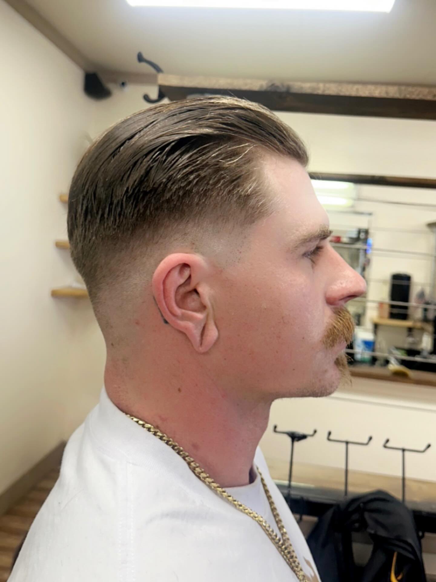 Sharp-Parted Sleek Slick Back with Tapered Sides