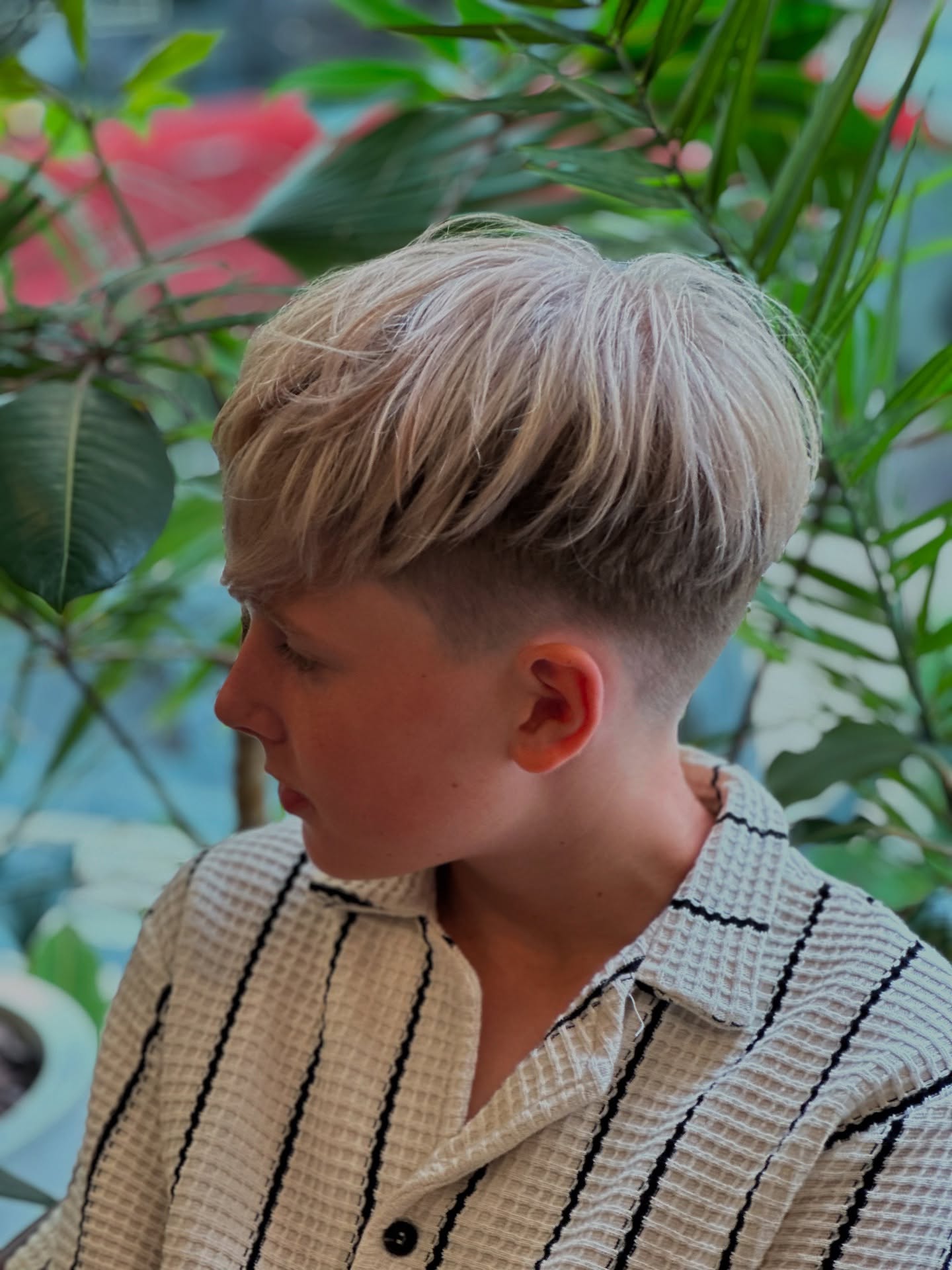 Short Blonde Feathered Style with Tapered Back