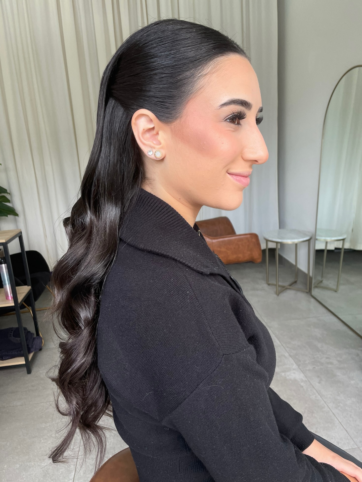 Sleek Ponytail with Soft Curls