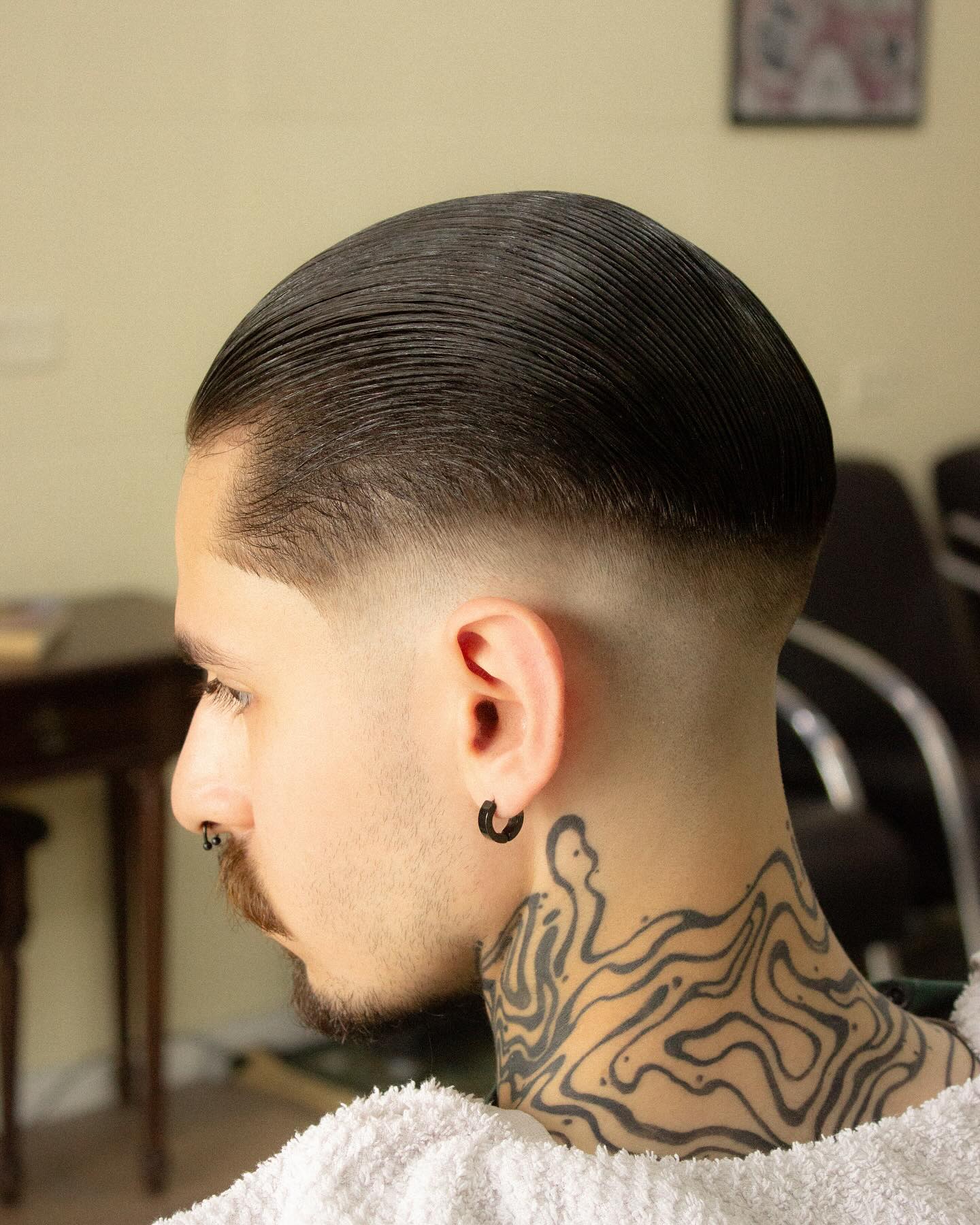 Smooth High-Shine Slick Back with Precise Fade