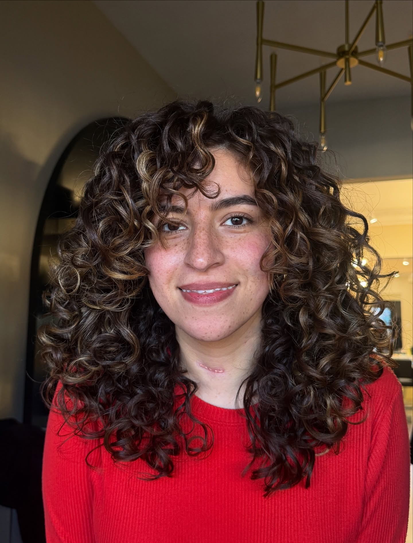 Cascading Chestnut Curls with Subtle Highlights