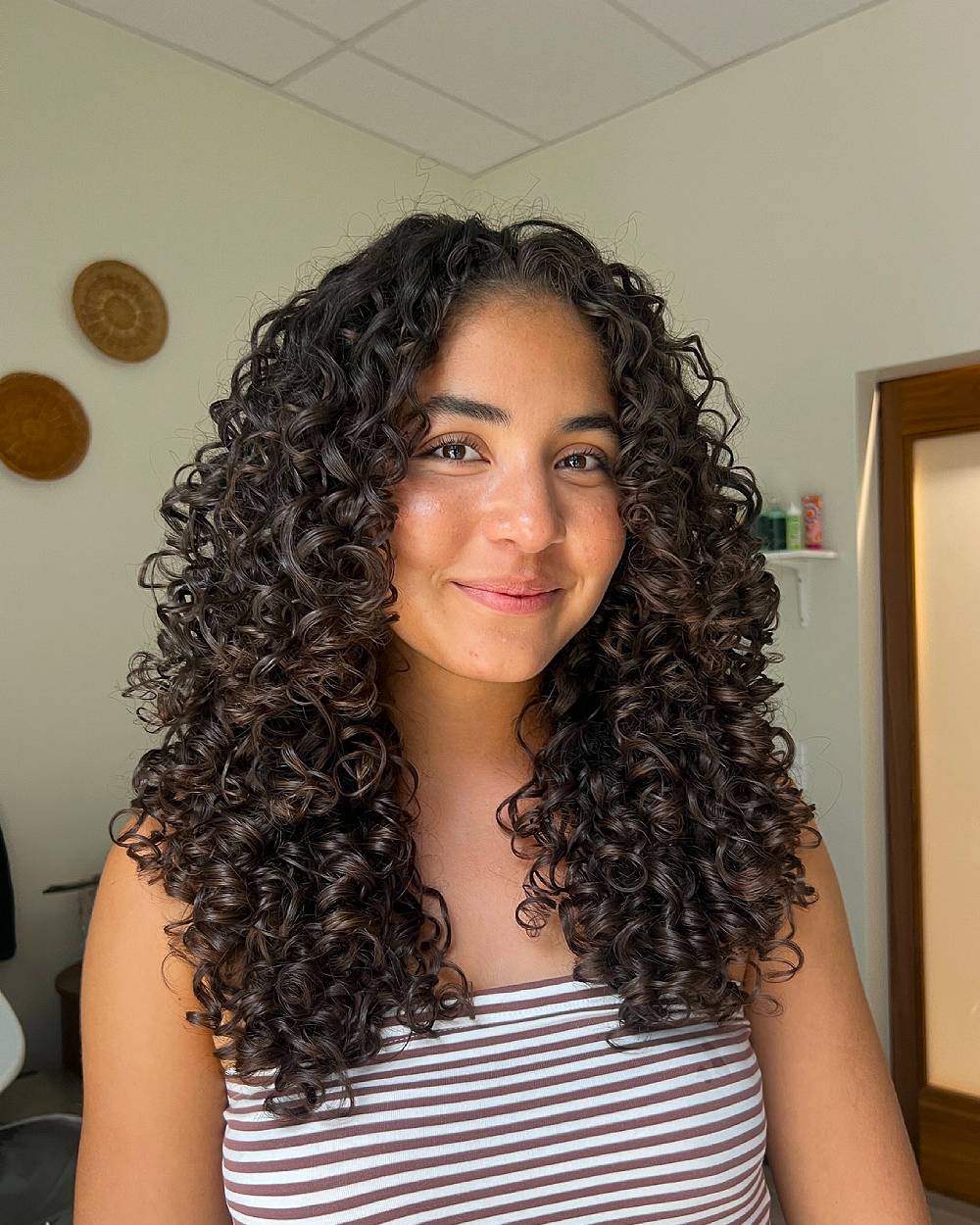 Charming Layered Curly Cut with Defined Curls