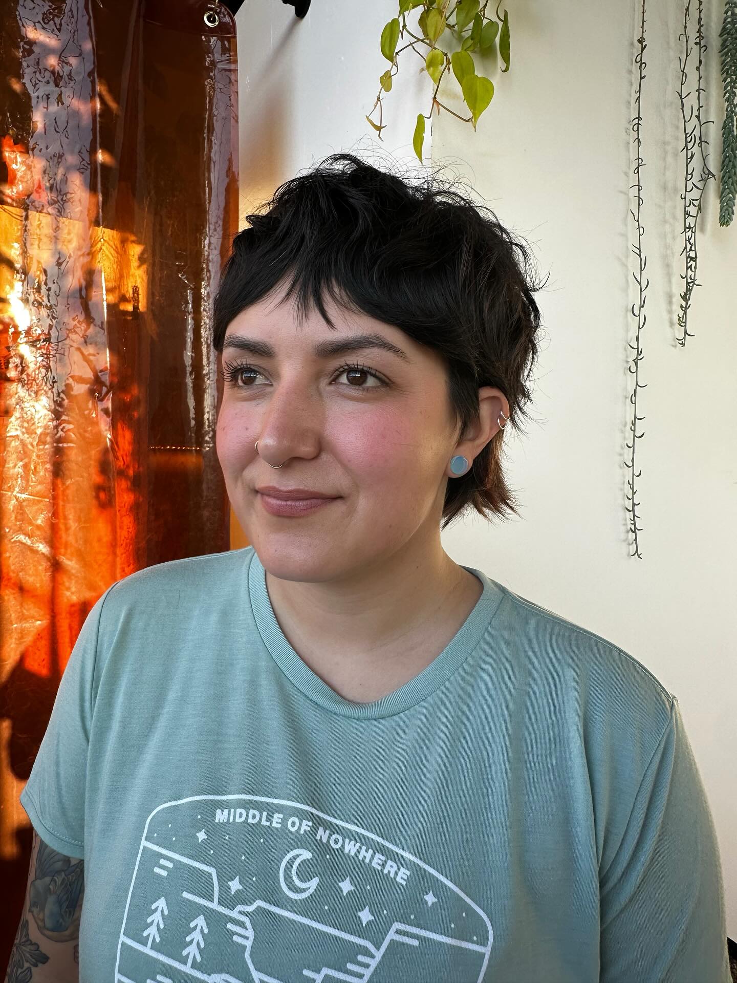 Chic Textured Black Pixie with Curved Bangs