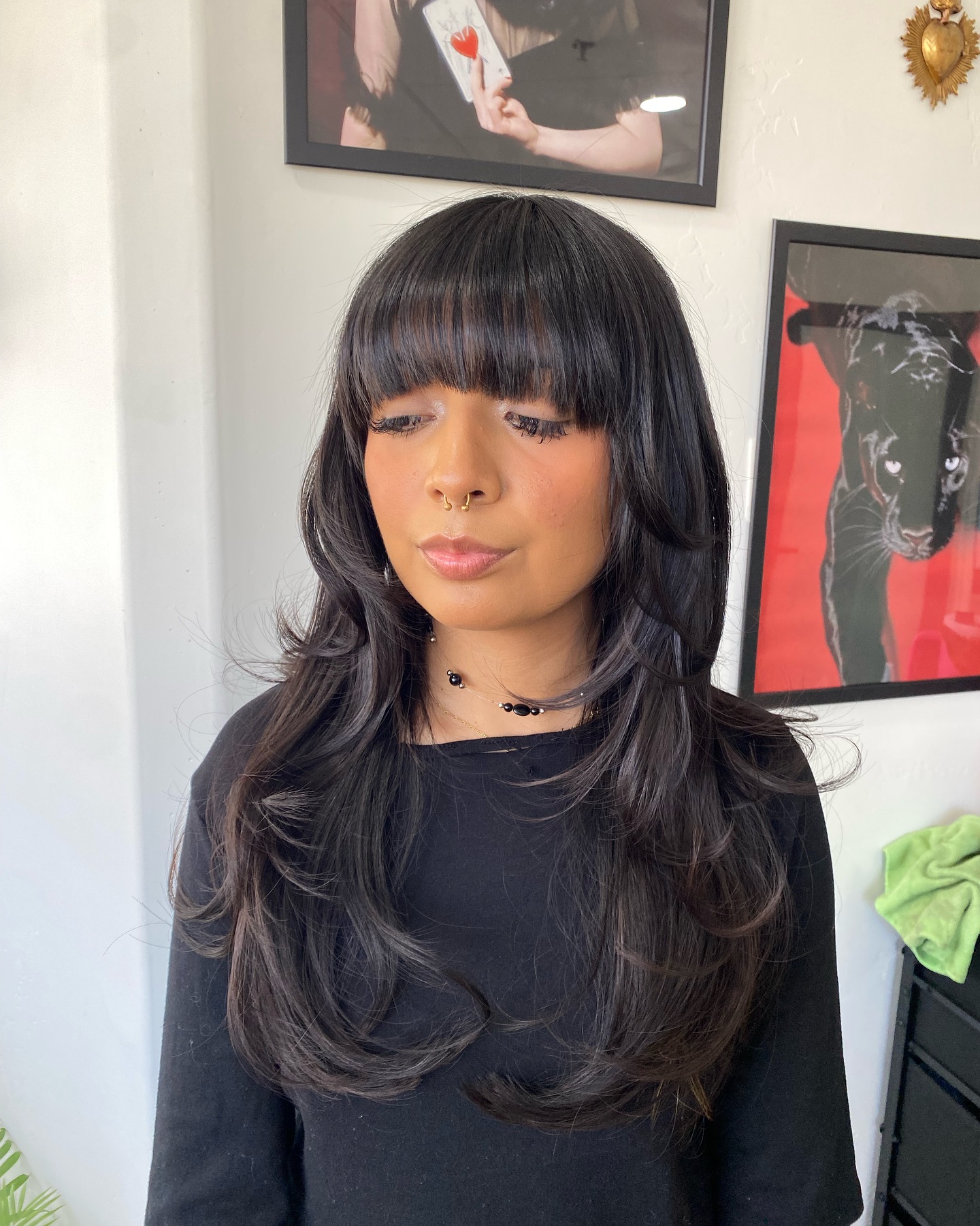 Jet-Black Cascading Curls with Full Bangs