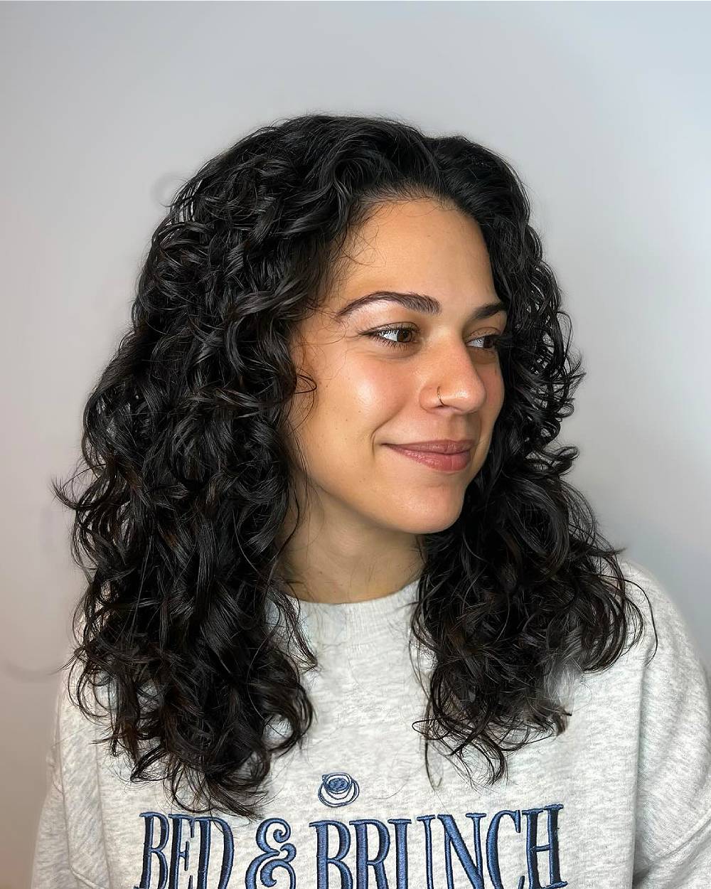 Layered Curly Cut with Soft Defined Curls