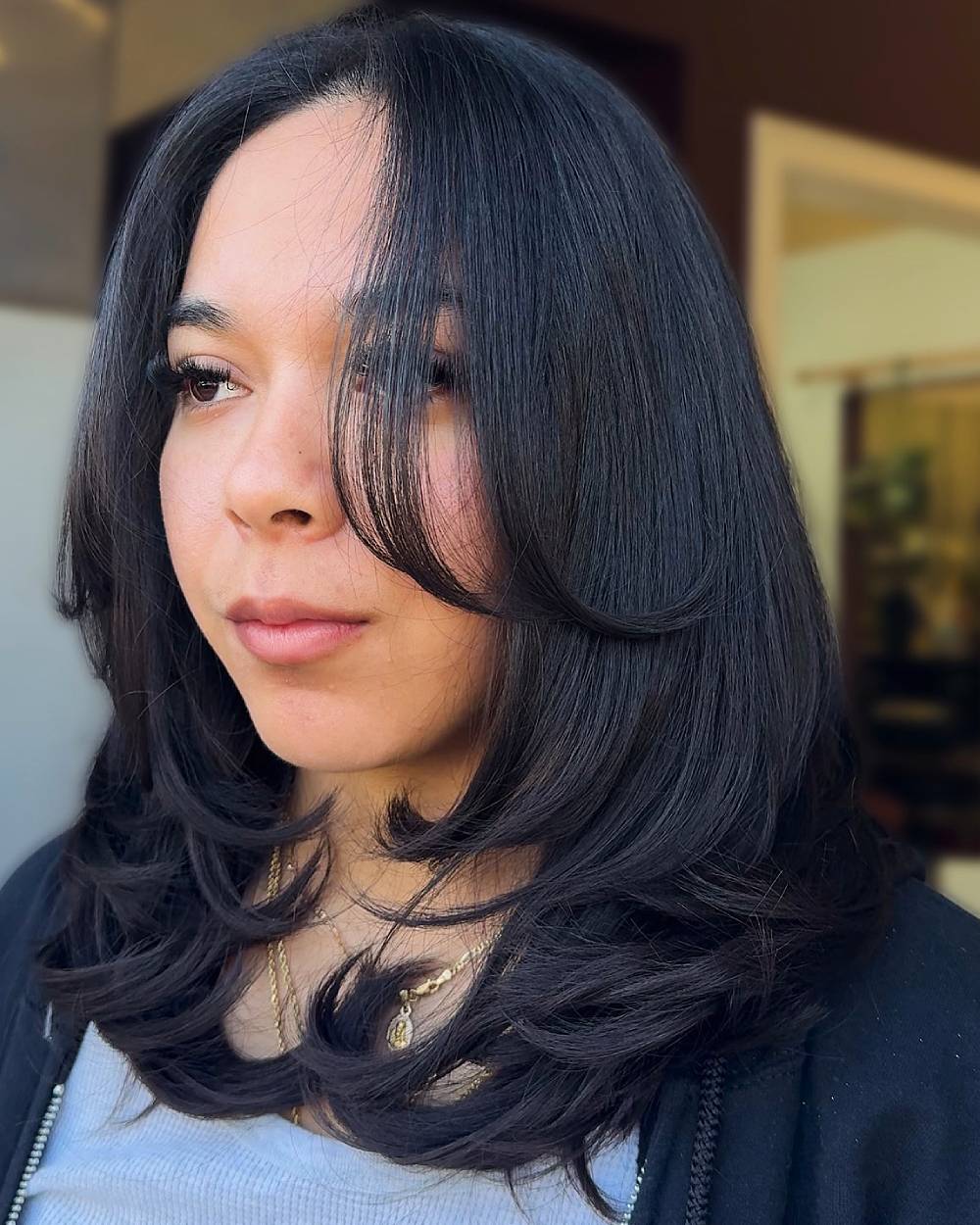 Modern Layered Cut with Face-Framing Bangs